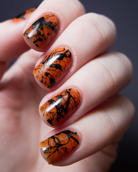 gallery-1441207555-orange-and-black-splatter-nails