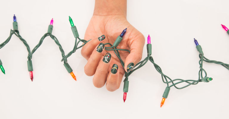 1450890221-syn-ghk-1449076021-single-hand-with-string-lights