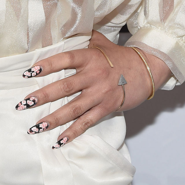 NEW YORK, NY - JANUARY 20:  Actress Dascha Polanco, nail & jewelry detail, attends as the NFL unveils Super Bowl 50 Bespoke Designer Footballs in collaboration with CFDA at NFL Headquarters on January 20, 2016 in New York City.  (Photo by Gary Gershoff/WireImage)
