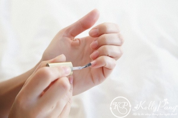Woman applying nail polish
