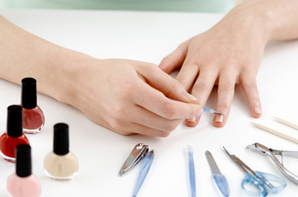 Woman manicure, with different accessories, close up (studio)