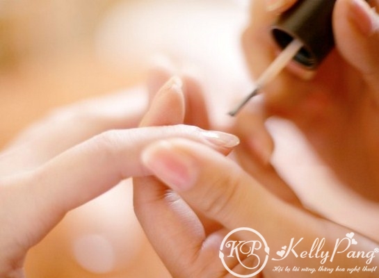 Painting Fingernails --- Image by © Royalty-Free/Corbis